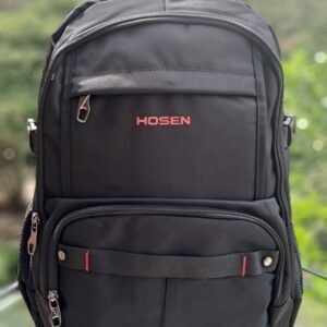 Morral negro marca Hosen con detalles en rojo, múltiples compartimentos con cremallera, bolsillos laterales de malla y asa superior reforzada para uso diario.